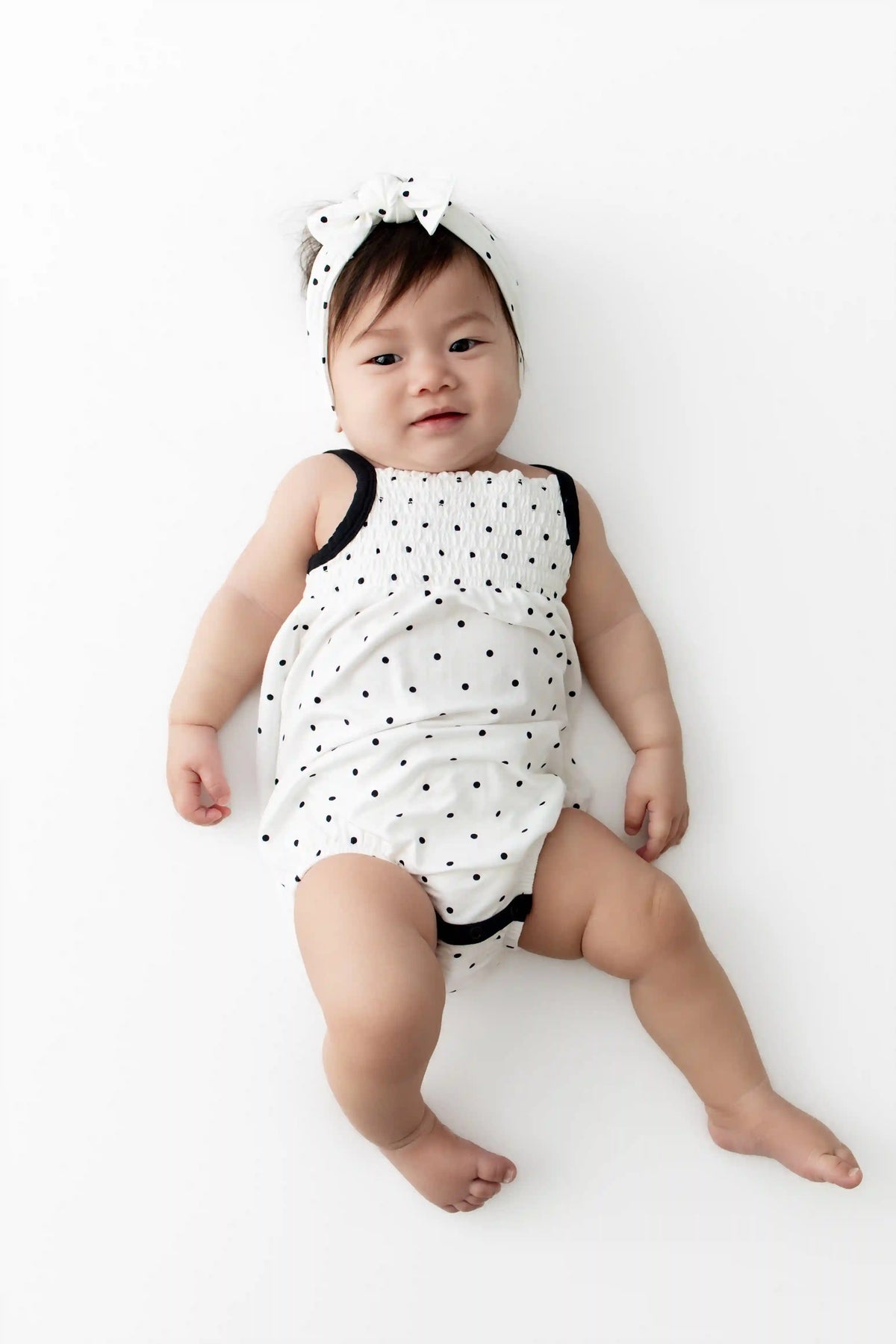 Smocked Bubble Romper in Midnight Polka Dot